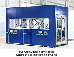 Two AdeptQuattro s650 robotics systems in a cell handling solar wafers