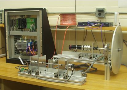 This multi-axis test bench is used to test PFIP control system electronics and software. The mechanical assembly to the right contains the Maxon motors, position encoders, limit switches, and inertial loads that simulate various PFIP mechanisms.