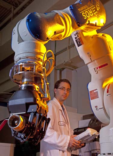 "Consortium members will have access to practical user services, including technical support and training, to foster the use of ROS-Industrial by industry," said Paul Evans, director of SwRI's Manufacturing Systems Department. "Another benefit: The membership will be driving the RIC research program, collectively deciding development priorities to meet members' most critical needs." "Southwest Research Institute founded the ROS-Industrial repository in January of this year, with support from Willow Garage and Motoman Robotics, to bring advanced robotics software to the industrial automation domain," explained Shaun Edwards, a senior research engineer in SwRI's Automation and Data Systems Division. "Building on the software libraries that ROS provides, ROS-Industrial will enable advanced capabilities and interoperability with a range of off-the-shelf industrial mobile platforms, manipulators, perception systems, and peripherals, without sacrificing the reliability and safety crucial for industrial systems," said Edwards. To date, ROS-Industrial has demonstrated capabilities unmatched using conventional industrial robot control for applications such as material handling in dynamic environments with on-the-fly object segmentation and grasp planning (http://youtu.be/_WG-45cZSUQ). Standard interfaces allow high-level software to work with any robot. ROS-Industrial supports robotic workcell visualization and simulation capabilities such as RViz, allowing system development and testing with or without physical hardware. ROS-Industrial allows device access over various wireless networks and advanced 2D-vision and 3D-point cloud sensor processing. Rich software development tools (based on standard Linux tools) include universal logging, debuggers and automated coding. Multiple robot path planners and optimizations allow developers to choose and customize systems that support high-degree-of-freedom systems coordinating multiple arms.